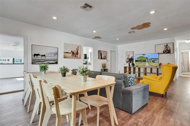 dining space featuring wood-type flooring