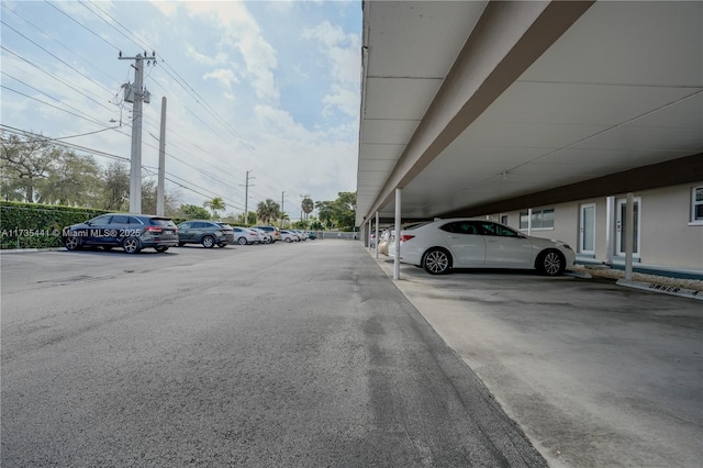 view of vehicle parking with a carport