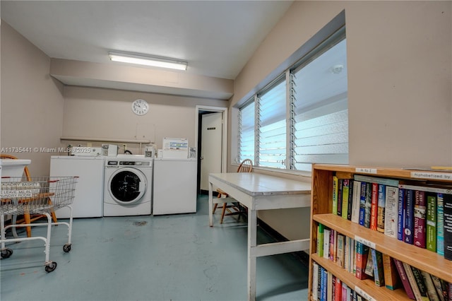 washroom with washer and dryer
