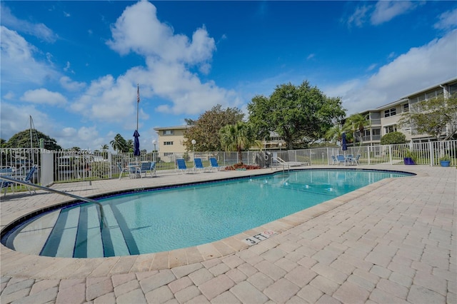 view of swimming pool featuring a patio area
