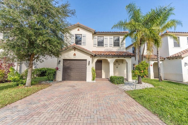 mediterranean / spanish-style home with a front yard