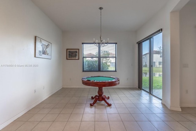 unfurnished dining area featuring light tile patterned floors and a chandelier