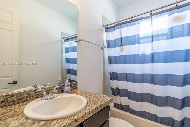 full bathroom with vanity, toilet, and shower / bath combo