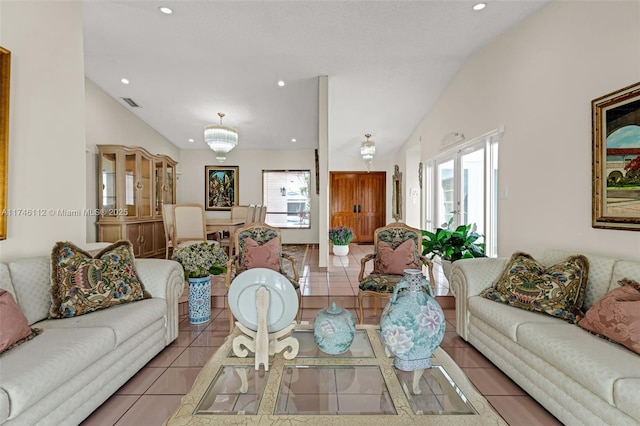 tiled living room featuring lofted ceiling and plenty of natural light