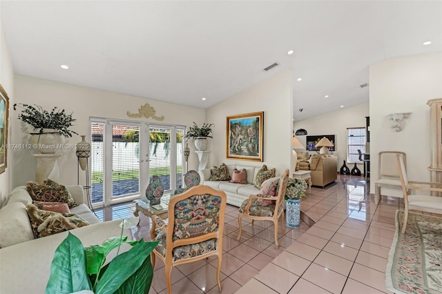 living area featuring lofted ceiling, light tile patterned flooring, recessed lighting, a water view, and visible vents