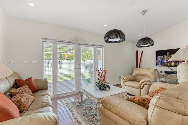 living area featuring recessed lighting, french doors, and tile patterned floors