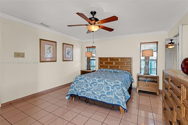bedroom featuring ornamental molding, visible vents, a textured ceiling, and light tile patterned flooring