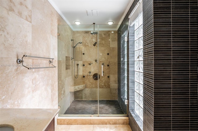 full bath with a stall shower, visible vents, and ornamental molding