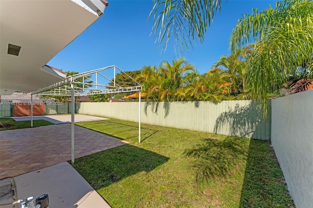 view of yard with a fenced backyard and a patio