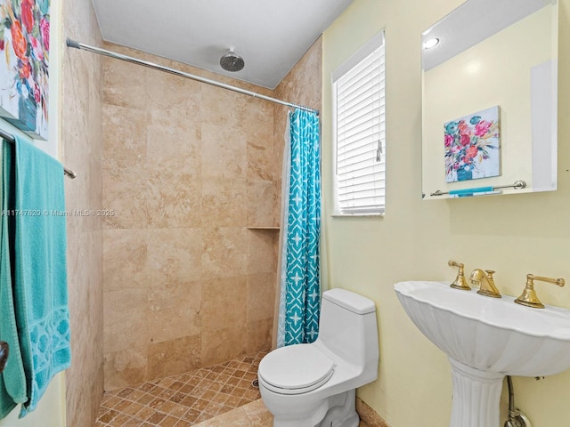 bathroom with toilet and walk in shower