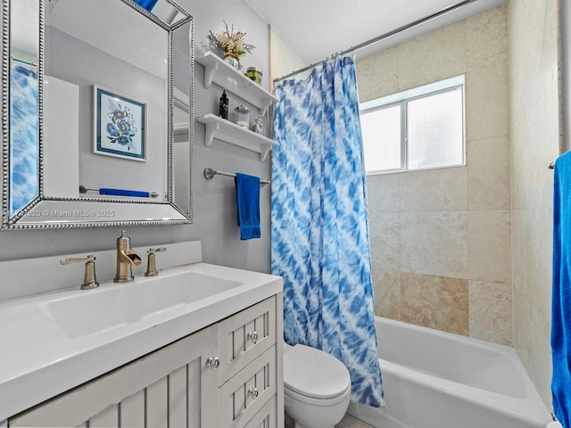 full bathroom with shower / tub combo with curtain, vanity, and toilet