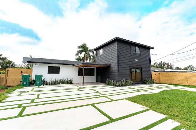 back of house with a patio area and fence