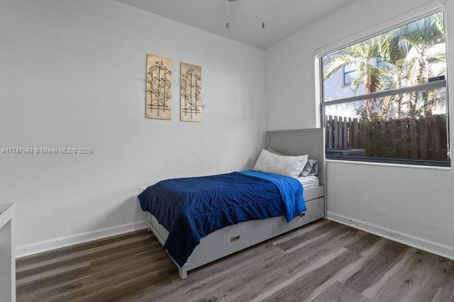 bedroom with hardwood / wood-style floors