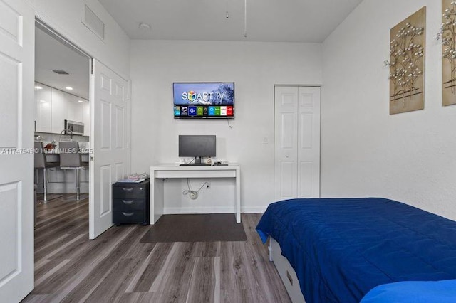 bedroom with hardwood / wood-style floors