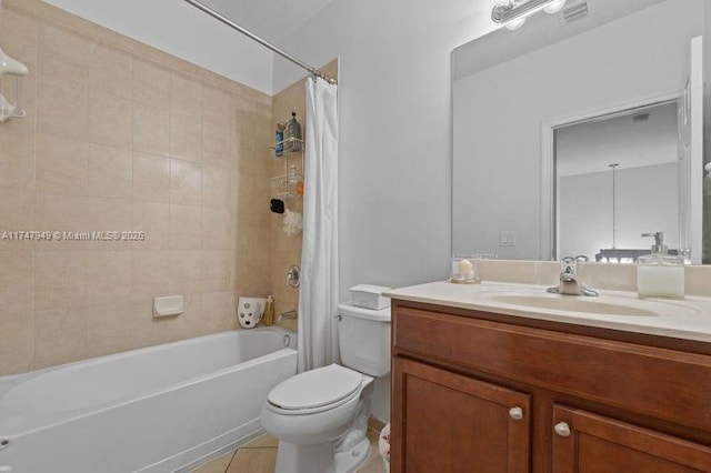full bathroom featuring vanity, tile patterned flooring, toilet, and shower / tub combo