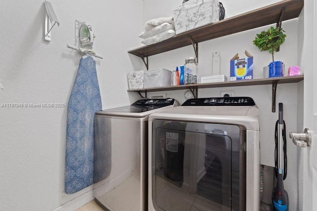 laundry area with washer and clothes dryer