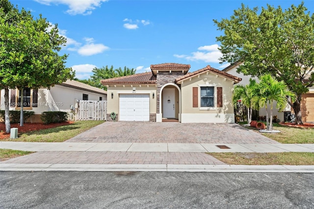 mediterranean / spanish-style home featuring a garage