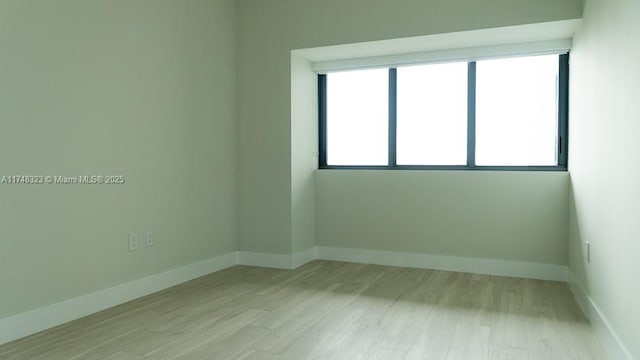 650 NE 32nd St Unit 2105, Miami, FL 33137 - unfurnished room with light wood-type flooring and baseboards