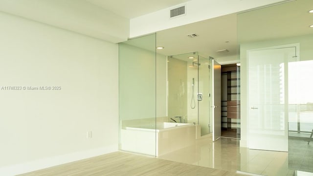 650 NE 32nd St Unit 2105, Miami, FL 33137 - full bathroom with a shower stall, a bath, and recessed lighting