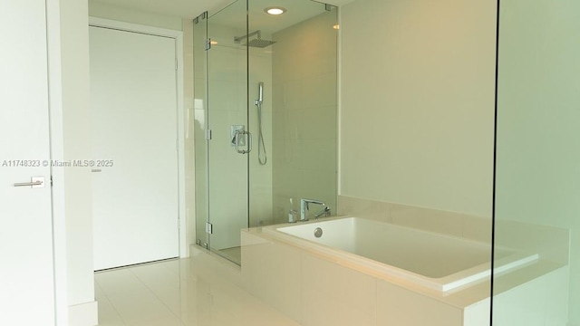 650 NE 32nd St Unit 2105, Miami, FL 33137 - bathroom with a shower stall, a garden tub, tile patterned flooring, and recessed lighting