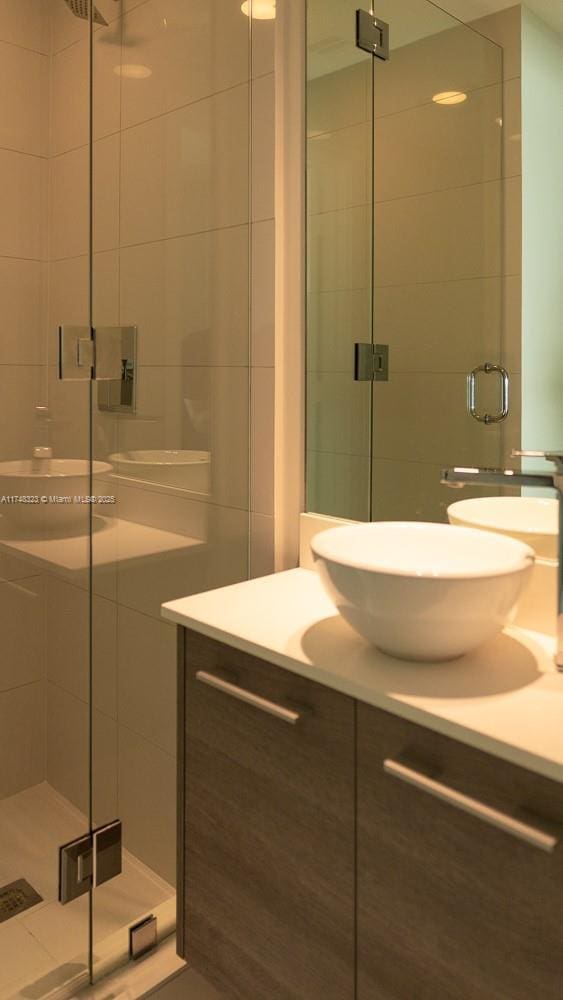 650 NE 32nd St Unit 2105, Miami, FL 33137 - full bathroom with vanity and a stall shower