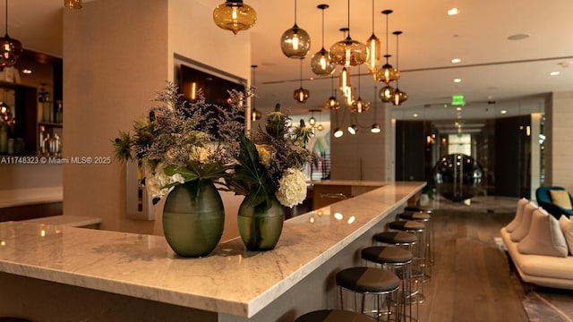 650 NE 32nd St Unit 2105, Miami, FL 33137 - community bar area featuring wood finished floors, hanging light fixtures, recessed lighting, and a chandelier