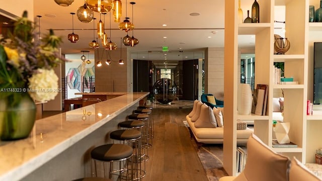 650 NE 32nd St Unit 2105, Miami, FL 33137 - bar area with dark wood finished floors, pendant lighting, a chandelier, and recessed lighting