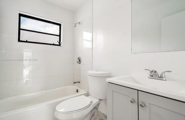 bathroom featuring shower / bath combination, toilet, and vanity