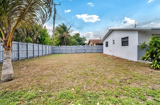 view of yard with a fenced backyard