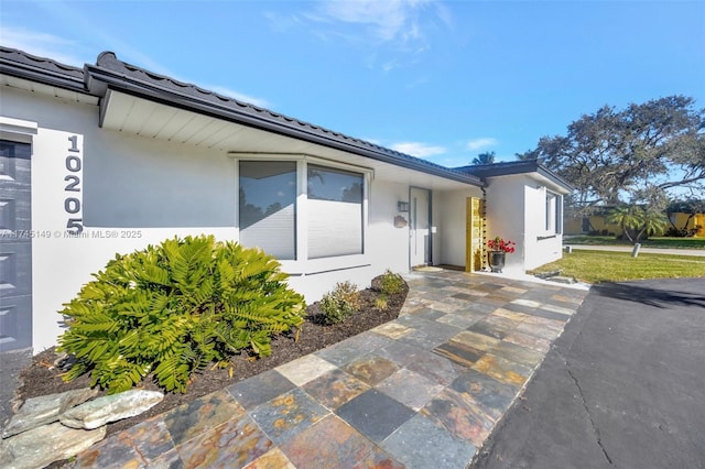 view of property exterior with a patio area and stucco siding