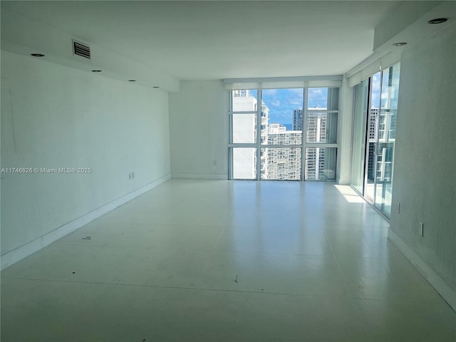 empty room with floor to ceiling windows