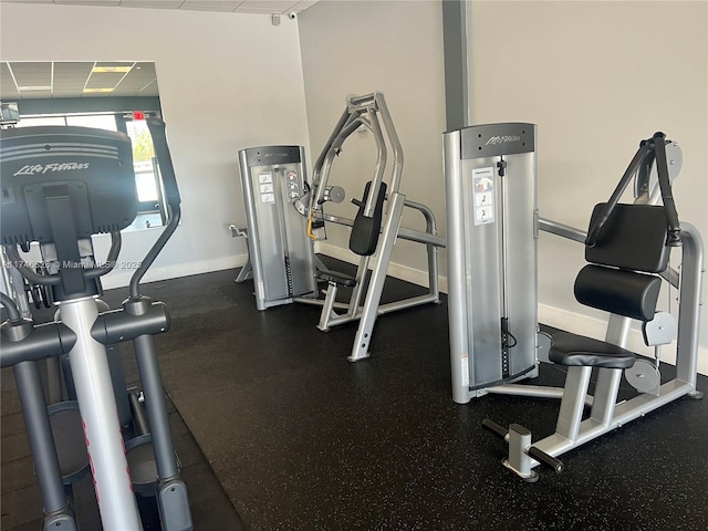 workout area featuring a paneled ceiling