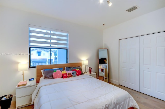 bedroom featuring a closet and light hardwood / wood-style floors