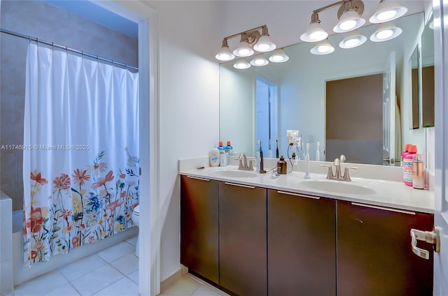 full bathroom featuring toilet, vanity, tile patterned flooring, and shower / bath combination with curtain