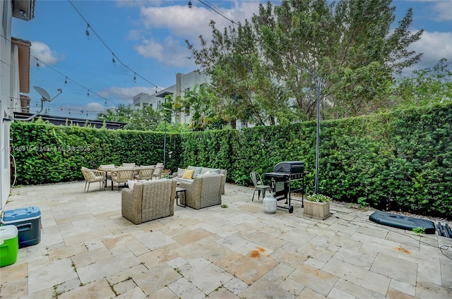 view of patio featuring an outdoor living space and grilling area