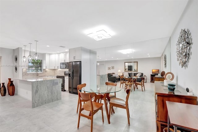 dining space featuring sink