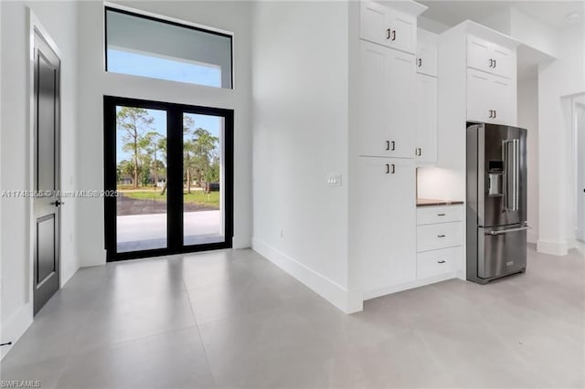 entryway with a high ceiling