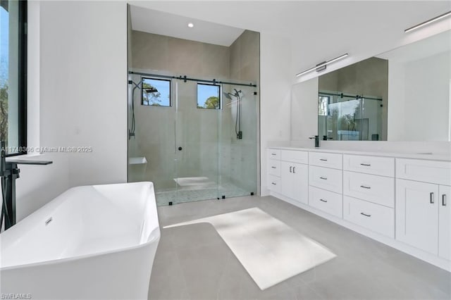 bathroom with independent shower and bath and vanity