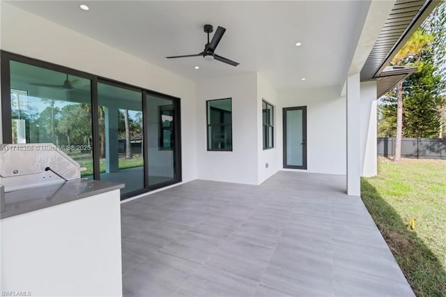 view of patio / terrace featuring ceiling fan