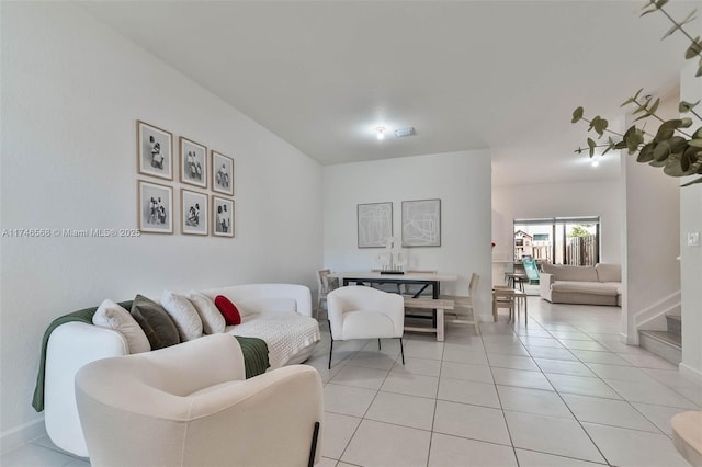 living room with light tile patterned floors and baseboards