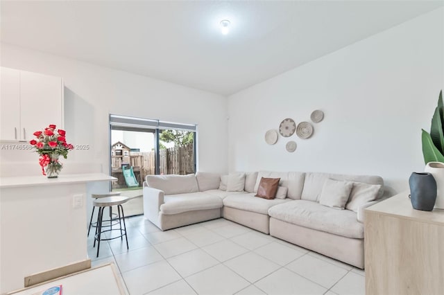 living area with light tile patterned floors