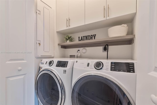 laundry room featuring cabinet space and independent washer and dryer