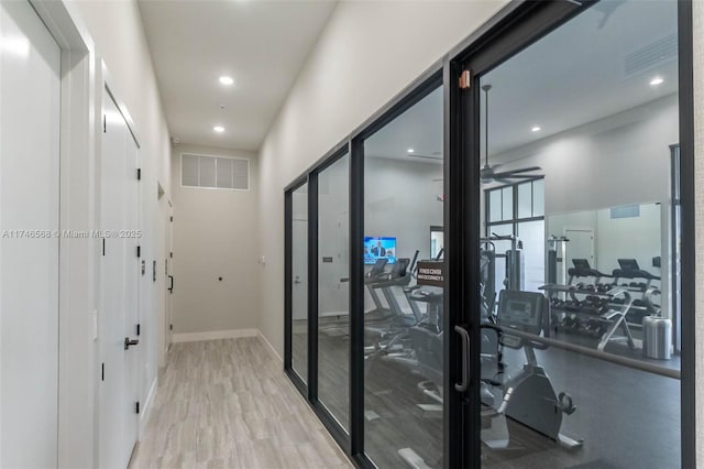 interior space featuring baseboards, recessed lighting, visible vents, and light wood-style floors