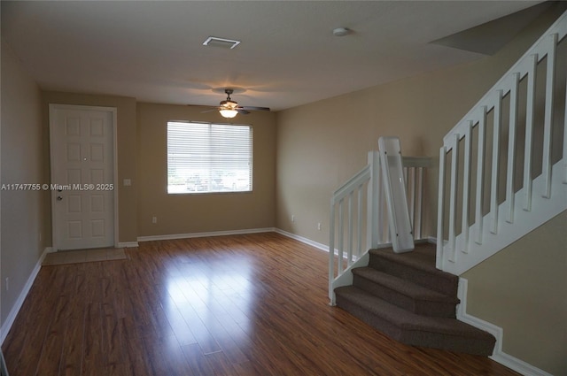 interior space featuring ceiling fan and dark hardwood / wood-style floors