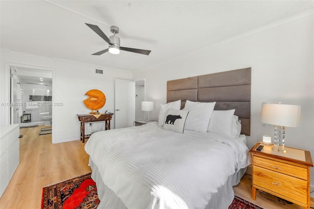 bedroom featuring ensuite bathroom, crown molding, ceiling fan, and light hardwood / wood-style flooring