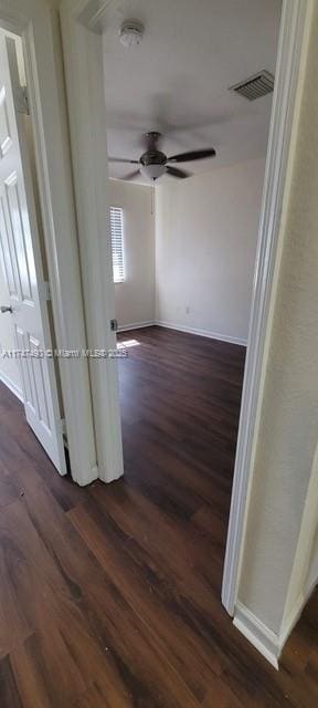 hallway featuring dark wood-type flooring