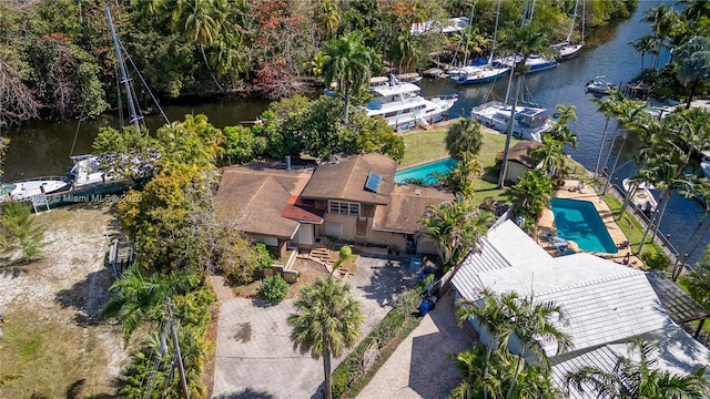 birds eye view of property with a water view