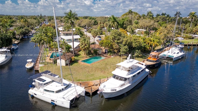 drone / aerial view with a water view