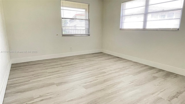 unfurnished room featuring light wood-type flooring