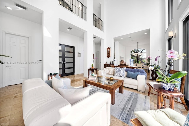 living room featuring a high ceiling